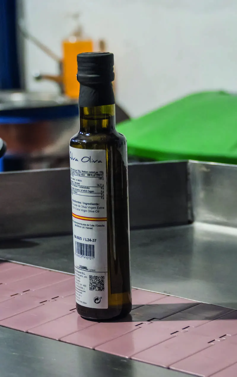 An Alva Oliva bottle on the bottling conveyor